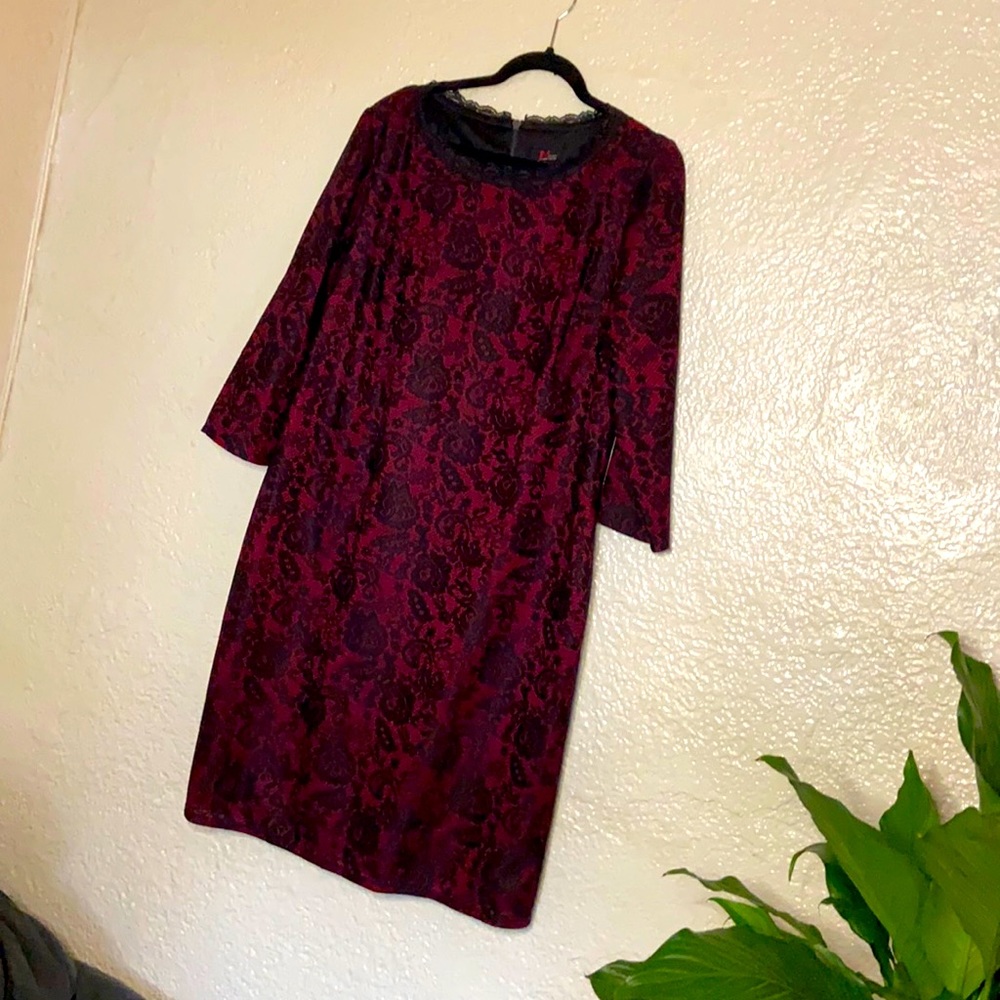 Red & black textured dress w/ lace trimmings.